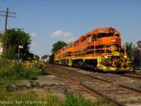 <b> The New Kid </b> on the block, QGRY 2500 is leading train 518-25 - Stratford Swing job. On weekends, 518 runs Stratford to Kitchener, down to the CP Interchange (CPR Waterloo sub) and back, performing work on the way (anywhere, really) as needed, and fairly often one of the tasks of the day is to bring loaded Toyota multis from CP to the yard for the next days 432.<br><br>At the time of this writing, catching the Stratford local power is the only way you'll see a solid GW Orange consist on GEXR - these engines usually power 581 from Stratford to Goderich and Hensall most weekdays and of course the swing job 518 on weekends. In time this will change, as the orange invasion continues..<br><br>Speaking of the invasion.. QGRY 2500 arrived a week or so ago, and the rumour according to trades employees is 2500 is to replace GEXR 3821 that is being sent away, to an unknown fate. One crew member told me 3821 needs rewiring but it's 'too expensive'. Doesn't sound good.. does it.