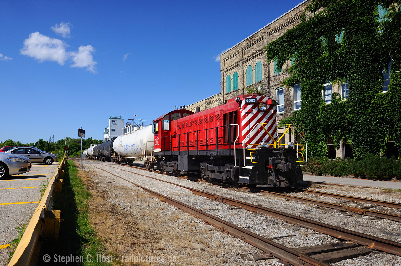 Impressive former Canadian Pacific 6593, restored and operating by the Waterloo Central Railway, is being 'borrowed' by GEXR as 584 switches two cars out, and two cars in for Chemtura in Elmira. A very rare daylight move, and with interesting power to boot. Due to the Region of Waterloo LRT construction, I am informed the line was essentially closed for the week due to culvert installation. Customer needed an emergency switch, and the Waterloo Central helped out with assistance from GEXR crew. Very nice to see an Alco S-3 switching freight cars after all these years.
At right is the sprawling and equally neat Chemtura facility in Elmira.