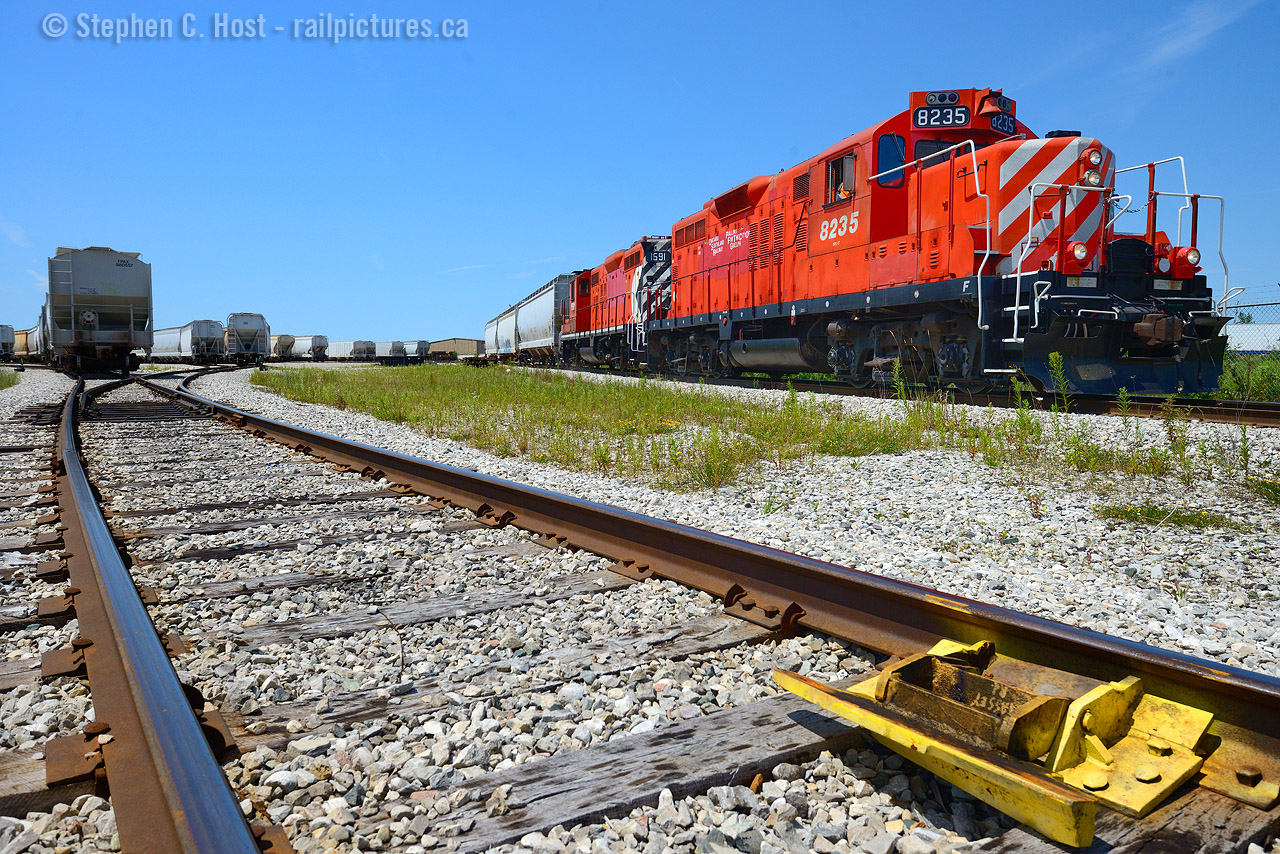 Derail marks the spot - "Massey Rd" is scrawled in the grime, as Ontario Southland Railway crew switches cars in the sprawling transload facility in Guelph.  To my surprise, both GP9's were out, a "Matched" pair of former CP Rail GP9's. Painted on the lead engine on the hoggers side is "Pulling for the City of Guelph".