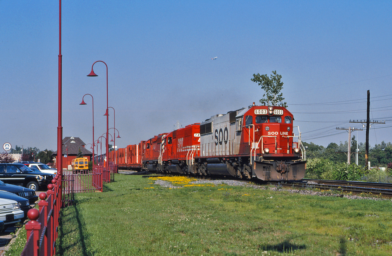 SOO 6003, SOO 746 and a CP SD40-2 lead train 421 westwards by the Beaconsfield AMT station in the middle of rush hour.  Once such a common sight, the SOO SD60s have become a treat to see in 2015.