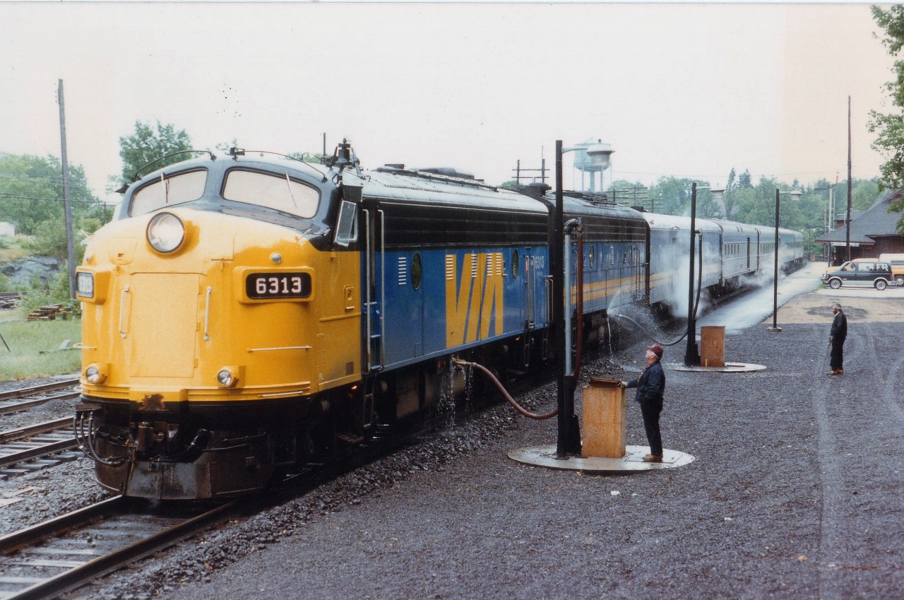 Toronto section of the Canadian, Northbound #9 is seen stopped at Parry Sound CP station for service. Let's be nice and neat about it, Lads. :o)  Second unit is 6631. The 6313 was sold to Ohio Central in 2002, same number, and then it went to Canadian Pacific as 4107 in 2006, after starting life as CN 6526, then to VIA 6526. So it has been around.