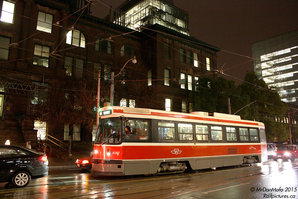 It was a rainy night downtown, and having just stepped off the streetcar onto College Street, it was fitting to grab a few night shots. TTC Canadian Light Rail Vehicle (CLRV) 4067 waits in traffic on a westbound 506 Dundas run, in front of the University of Toronto's Mining Building on College at McCaul.

Elevated to iconic status as "the" streetcars of Toronto for decades (since they started replacing the venerable PCC cars in the late 70's), Toronto's fleet of aging Hawker Siddeley/UTDC CLRV and ALRV streetcars are on the way out, as new modern low-floor articulated Bombardier streetcars start to arrive by flatcar from Thunder Bay. A few oldies have already been retired and scrapped, while the rest are being kept working as best as possible until supply chain issues with Bombardier's assembly plants are resolved.

Like all the H-series subway cars replaced over the last few years, the same saying holds true: get 'em while you can, because when they're gone, they're gone.