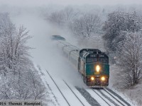 There is a certain kind of snow, when the temperature is just right, that is damp enough to cling to every surface and makes a veritable winter wonderland. Boxing Day 2013 saw the Toronto area blanketed in just this kind of snow. VIA 6406 leads 908 on the train 54-56 J train on its way to Oshawa and points east.