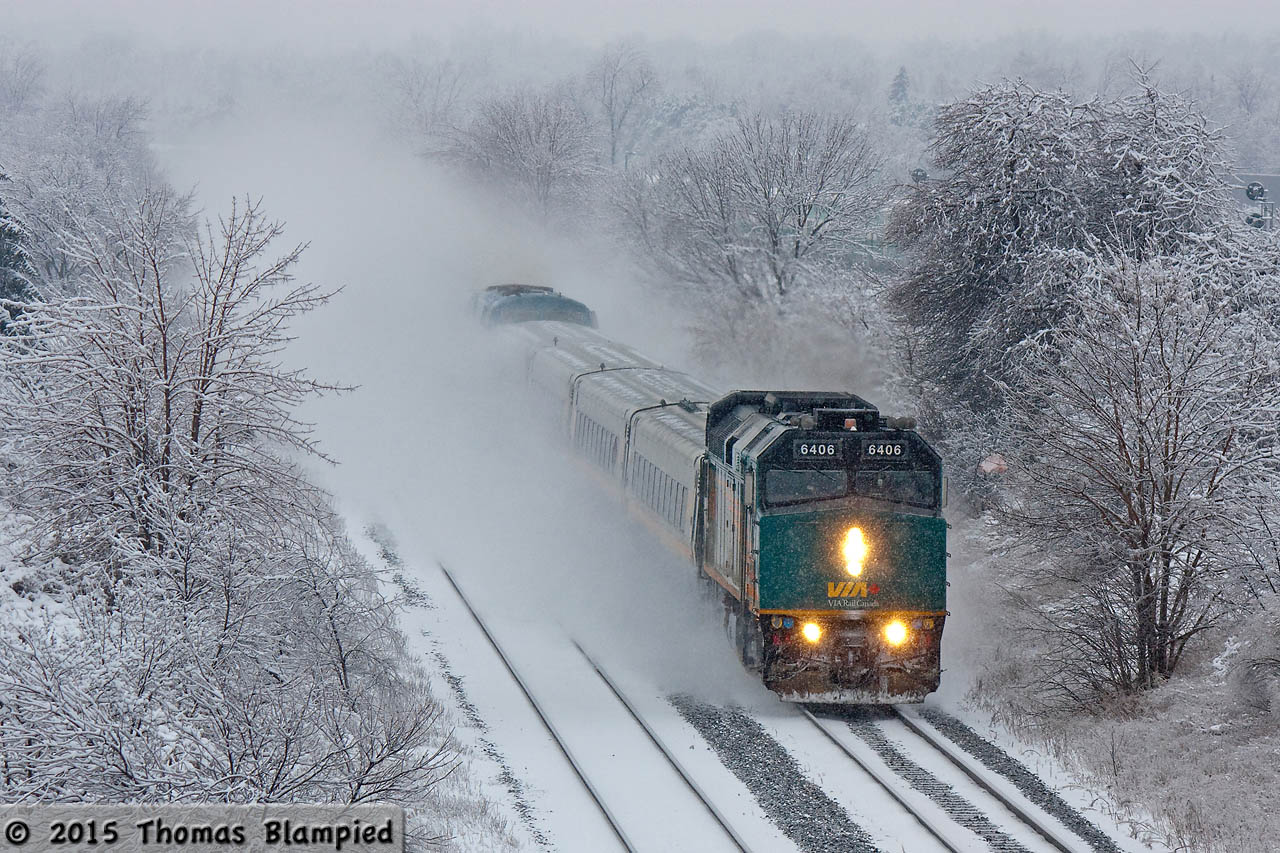 There is a certain kind of snow, when the temperature is just right, that is damp enough to cling to every surface and makes a veritable winter wonderland. Boxing Day 2013 saw the Toronto area blanketed in just this kind of snow. VIA 6406 leads 908 on the train 54-56 J train on its way to Oshawa and points east.