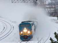 As a heavy snowstorm snarls cars and buses, VIA train 65 powers on through the snow.