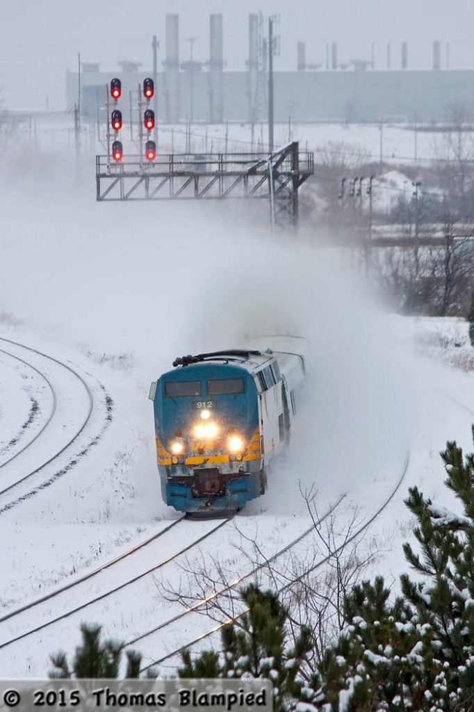 As a heavy snowstorm snarls cars and buses, VIA train 65 powers on through the snow.