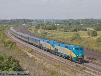 An extra-long train 60 rounds the curve at Whitby. Glen Fraser is on the tail end.