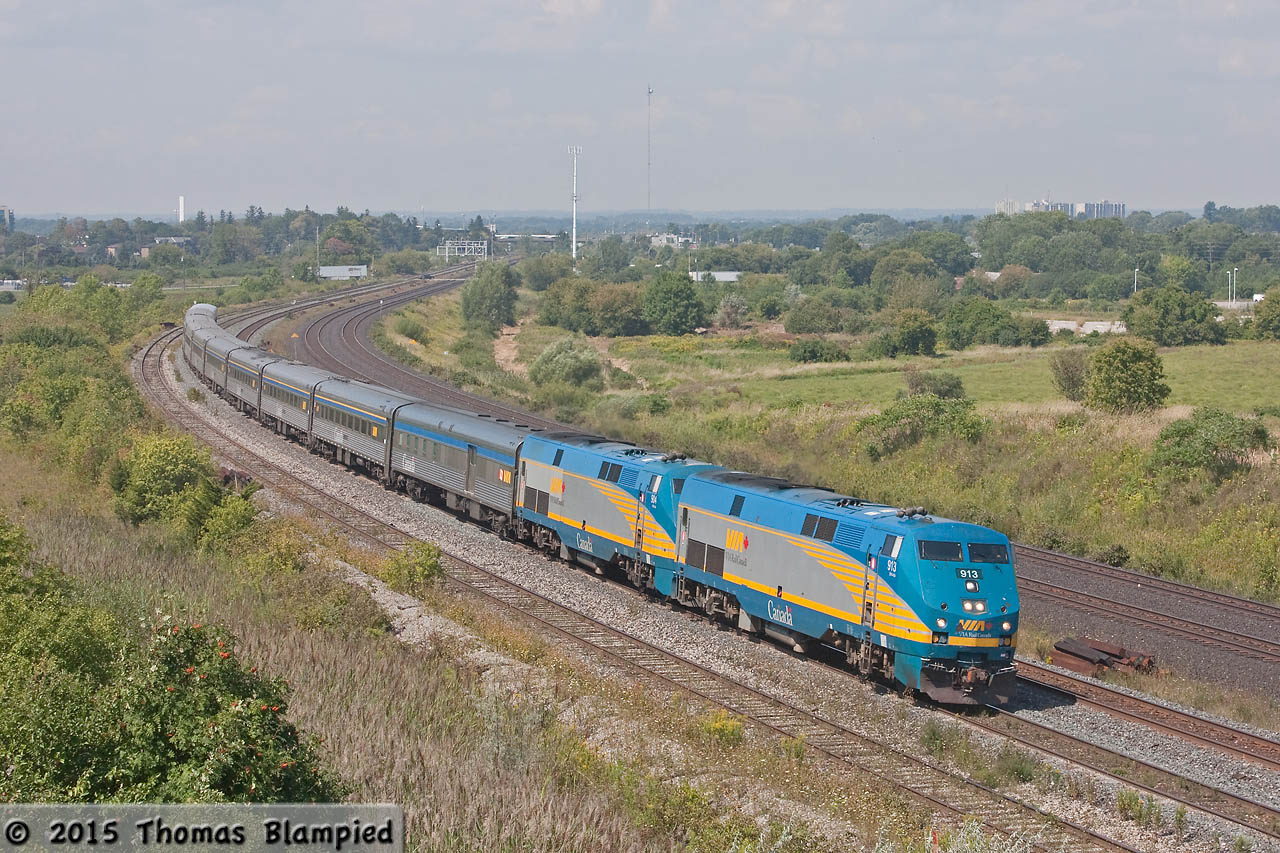 An extra-long train 60 rounds the curve at Whitby. Glen Fraser is on the tail end.