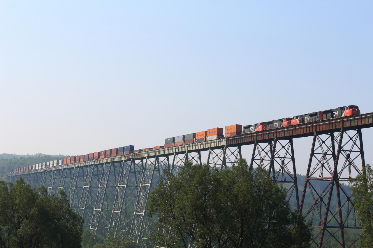 CN 5691 leads the daily "Q121" stacker across the nearly 4,000 foot "Salmon River Trestle" in New Denmark, New Brunswick. Always worth getting a shot of this massive structure when I'm in this area, even if it's only once or twice a year.