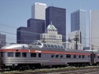 Canadian Pacific's 'Park' series round end observation car awaits servicing for the afternoon departure of the westbound Canadian at Toronto's John St yard on May 28, 1978. Toronto's skyline, including CP's Royal York hotel make an impressive background. Without any doubt, Canadian Pacific's Park cars with their sleeping arrangements, dome seating, rear end lounge and accompanying bar service set a high bar for the ultimate in train riding.