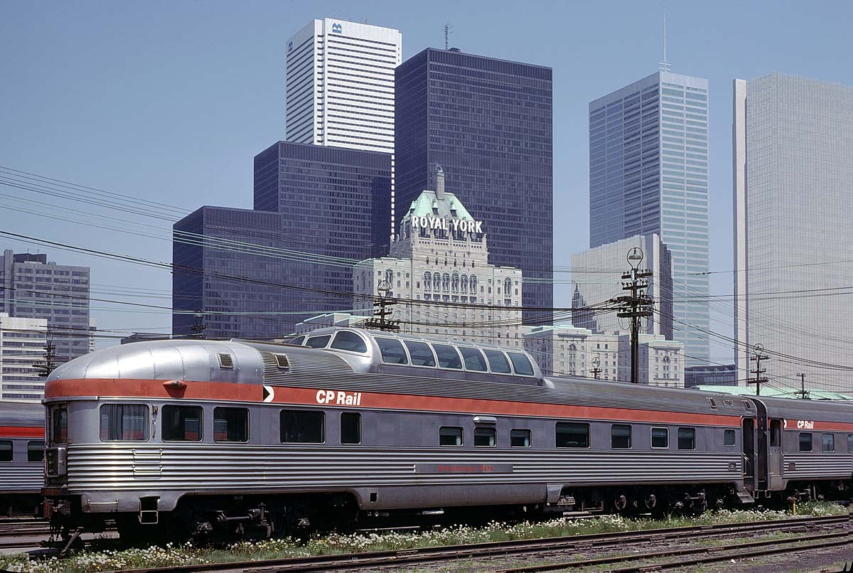 Canadian Pacific's 'Park' series round end observation car awaits servicing for the afternoon departure of the westbound Canadian at Toronto's John St yard on May 28, 1978. Toronto's skyline, including CP's Royal York hotel make an impressive background. Without any doubt, Canadian Pacific's Park cars with their sleeping arrangements, dome seating, rear end lounge and accompanying bar service set a high bar for the ultimate in train riding.