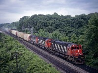 An eastbound freight with 3 big Alcos from MLW coming through Bayview Jct on June 28, 1986 with brake shoes still smoking after descending the escarpment. We thought the setup was kind of odd with the 3 cars in front of the dead-it-tow switcher.  The next time we saw the train on the north side of Toronto (one cloudy shot wasn't going to be enough for this one), the box cars had been set off.  