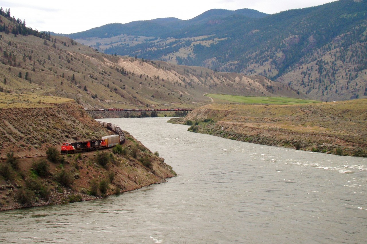 A westbound CN mixed freight snakes along the Fraser River in B.C.'s interior bound for Vancouver. CN and CP both have mainlines through this area (this train is on CN, while the CP rails can be seen on the opposite side of the river) with a trackage agreement that allows directional running for 160 miles through the Fraser Canyon-the CN line handles westbound traffic, and the CP line handles eastbound traffic.