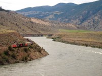 A westbound CN mixed freight snakes along the Fraser River in B.C.'s interior bound for Vancouver. CN and CP both have mainlines through this area (this train is on CN, while the CP rails can be seen on the opposite side of the river) with a trackage agreement that allows directional running for 160 miles through the Fraser Canyon-the CN line handles westbound traffic, and the CP line handles eastbound traffic. 