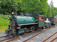 Coupled behind Loco #2, #1 sees the light of day for the first time in many a year. Looking rather naked without her saddle tank (barely visible sitting beside the tracks on the far side of #2), she has been hauled out of the dark depths of the train shed to have pictures taken to aid in the making of technical drawings, part of the long and painful process of getting her certified to return to active duty.