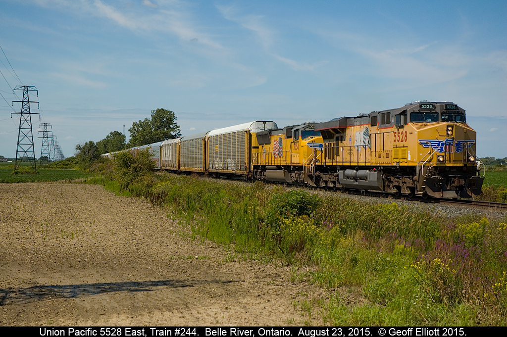 Looking like a shot taken in Illinois or Iowa, UP 5528, and sister 5054, lead Canadian Pacific train #244 through Belle River on August 23, 2015.