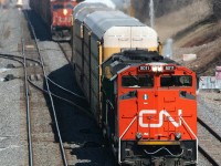 Three CN Auto related trains - now all history....  In the first couple of years since track 3 opened in 2006, It seemed to get it's fair share of usage.  Here -  CN train 271 - solid autos from the GM assembly plant in Oshawa bypasses stopped train 431 - which was parts cars from Oakville/Aldershot to the Ford stamping plant in Woodlawn NY ( South Buffalo )  The approaching headlight is CN 333 which originated in Oakville with finished autos and some miscellaneous traffic for CSX.  All 3 trains no longer exist -  271 died shortly before the recession and the subsequent closing of one of the Assembly plants,  333 and 431 morphed into today's 421.