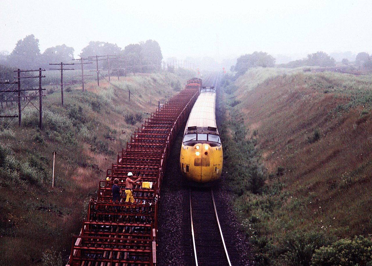 The Turbo passes a rail train putting down rail on a muggy August day. One of my brothers photos.