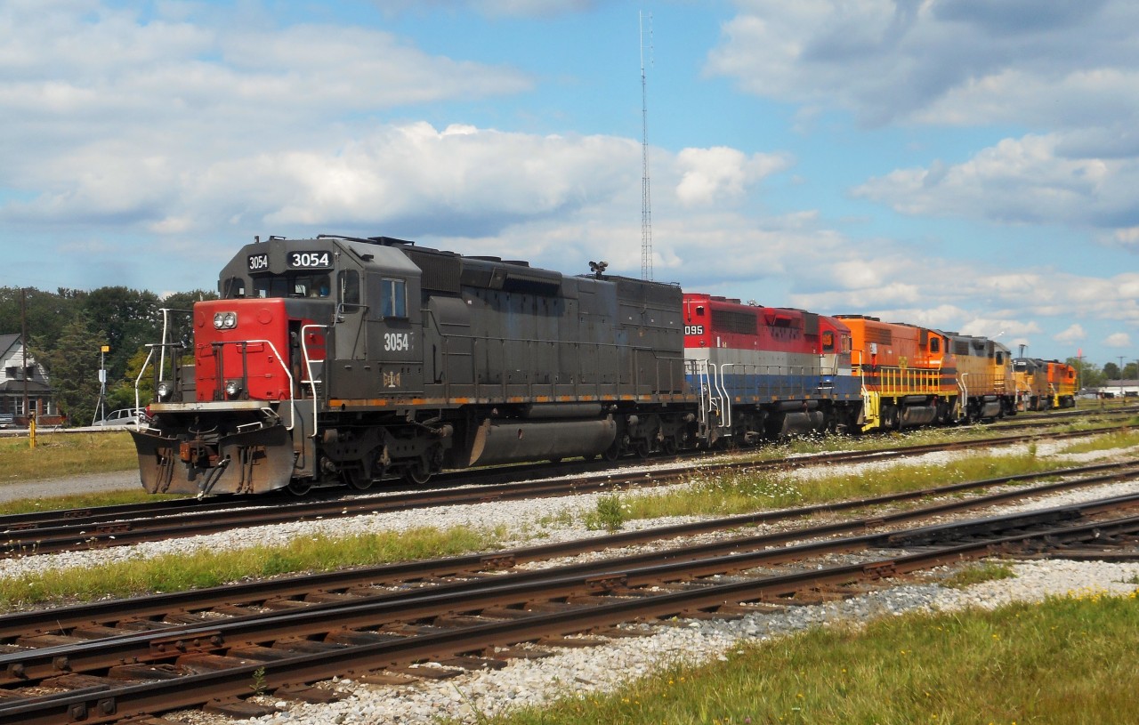 While waiting for the CN TEST train to get clearance onto the Guelph Sub, the power for 431/432 (3054, 4095, 3030, 2210) sits after their trip to Toronto and back.  On the next track, in the distance, is 2236 and 2303, the power for train 581/518/433, idles for the evenings work.  In front of 2236, but blocked by the 431's power, is GEXR 3821, which was supposed to be replaced, but plans have changed.