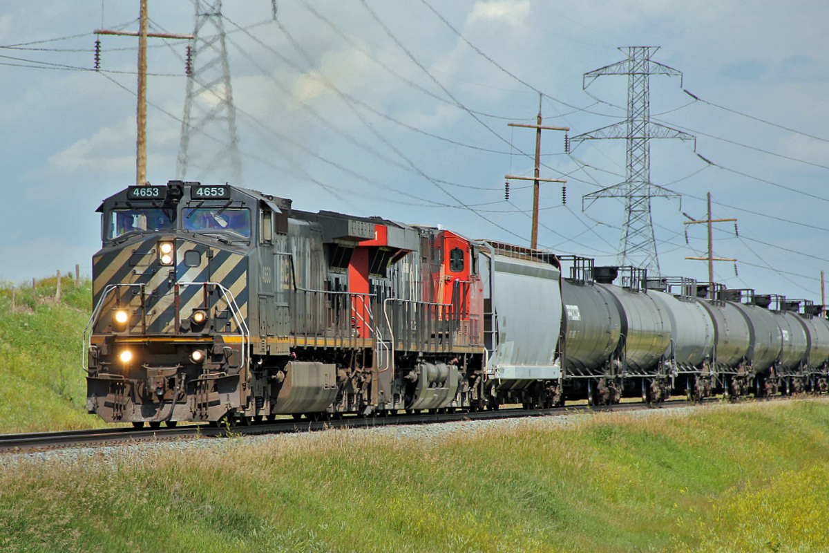 EX BC Rail DASH9-44CW 4653 and ES44DC CN 2341 head south towards Edmonton on CN's Vegreville sub.