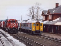 Little bit of action seen at the historically designated Cartier CP station on this rather dreary spring morning. VIA Budds; Sudbury-White River #185 has paused for passengers, coming in on its' scheduled 1035 timeslot, about 20 minutes behind CP #917 on the left; which is awaiting a new crew and the departure of the VIA. The VIA #185 has Budds 6215 and 6250; the #917 has CP 5793 and HATX 802. Note a minor roof repair on the corner of the station. I was told a Jordan Spreader knocked off a piece earlier in the winter........