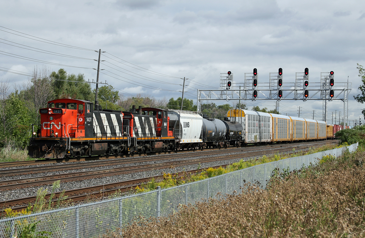 CN 1437 and CN 1444 depart Oakville Yard with train L 55431 26.  This transfer between Oakville and Aldershot departs early afternoon to make connections with 435, 434 and 399 at Aldershot and has been running with a pair of GMD1s for the last week or so.