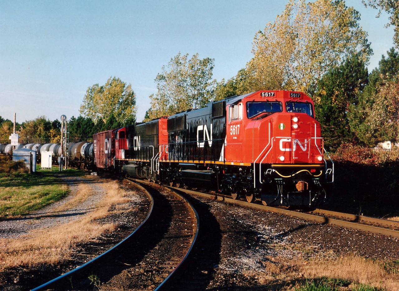 Very few locomotives I like less than the SD70s on CN. The only exceptions are CN SD75s and those dirty GEs on CP. But, those SDs with the runny watercolour paint and tattered appearance actually were rather attractive when new. Here is an example; CN 5617, only 4 days old, followed by 5614, in its' 22nd day, about to enter the Grimsby Sub., westbound. The track running left in the photo is part of the wye as seen from Stanley Av. These locomotives have been around 20 years already.