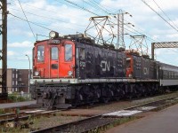 CN Z4a boxcab electric locomotives 6723 and 6722 pose at Val Royal station, working Montreal area commuter duties on the Deux-Montagnes line. Built in the mid-20's by English Electric for the National Harbour Board, the units worked with similar looking GE boxcar electrics and would be renumbered once or two over the decade, until the end of their operation in 1995 (the old electric fleet was replaced during a modernization program of the line). Val Royal station, originally named Lazard, was renamed again and is currently AMT's Bois Franc station.