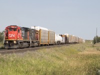 A westbound CN mixed freight starts its trip on the Watrous sub after making its crew change in Melville.