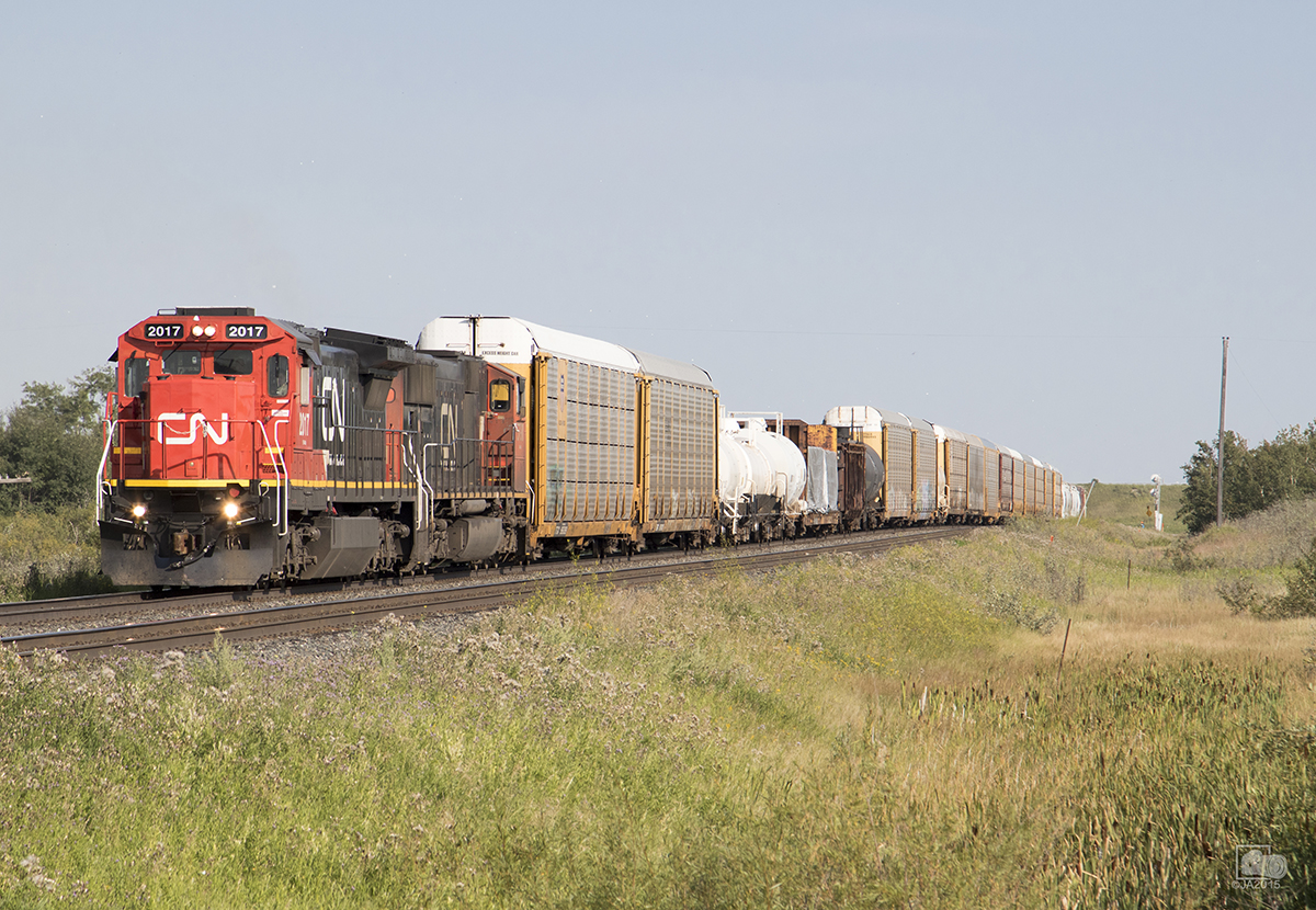 A westbound CN mixed freight starts its trip on the Watrous sub after making its crew change in Melville.