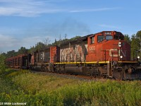 CN 5303 and 5322 scoot up the valley at mile 47 of the Bala Sub with 486's train of 65 CWR and crude oil loads. Their pace will diminish in the next 10 miles as they begin the climb up the Oak Ridges Moraine.
<br><br>
I used to scoff at a consist like this on the Bala when I first started shooting up here, preferring anything exotic, which in the late 1990's wasn't really much. Now all of those GP and SD40's are good catches (if you can catch them), and I waited close to two hours here for this guy to arrive. 1918hrs.