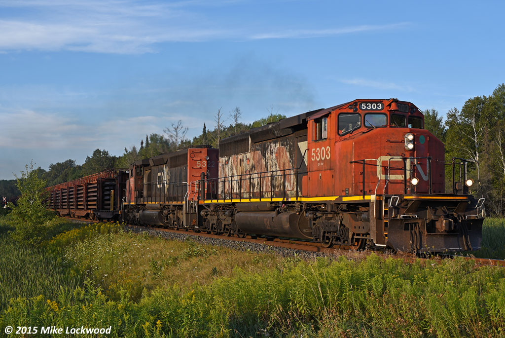 CN 5303 and 5322 scoot up the valley at mile 47 of the Bala Sub with 486's train of 65 CWR and crude oil loads. Their pace will diminish in the next 10 miles as they begin the climb up the Oak Ridges Moraine.

I used to scoff at a consist like this on the Bala when I first started shooting up here, preferring anything exotic, which in the late 1990's wasn't really much. Now all of those GP and SD40's are good catches (if you can catch them), and I waited close to two hours here for this guy to arrive. 1918hrs.