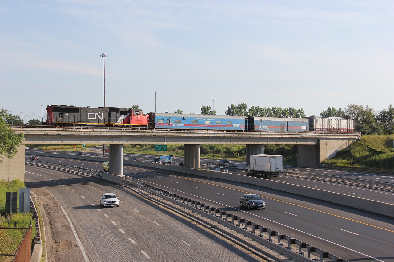 The CN Engineering Test Train (I'm not sure the train number) slowly makes its way west on the GEXR Guelph Sub through Kitchener. On Thursday, it was heading east through Kitchener around 14:30. It headed back west from Georgetown Thursday afternoon but ran out of time and got outlawed in Guelph. The following morning, it was on the move again. Here it is pictured over the Conestoga Parkway (the very south end of Highway 86) at 08:34. This was my first day late for work!