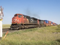 3 miles west of Melville, SK CN 8849 takes charge on this westbound Q series train. 