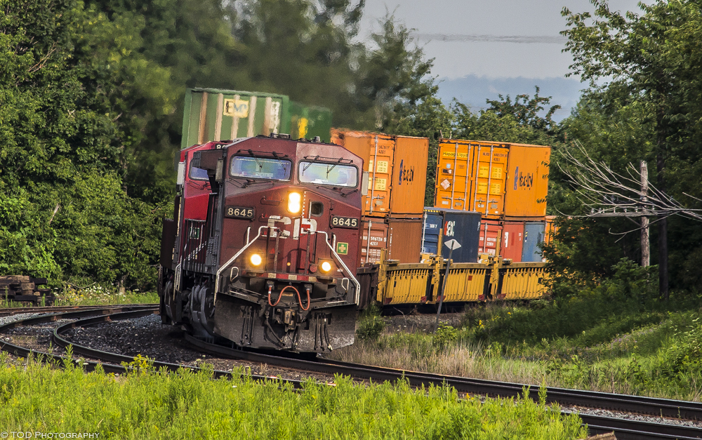 After hearing a train rumbling along in the distance, CP 142 finally shows itself and comes around the corner at Lovekin on a beautiful summer morning.