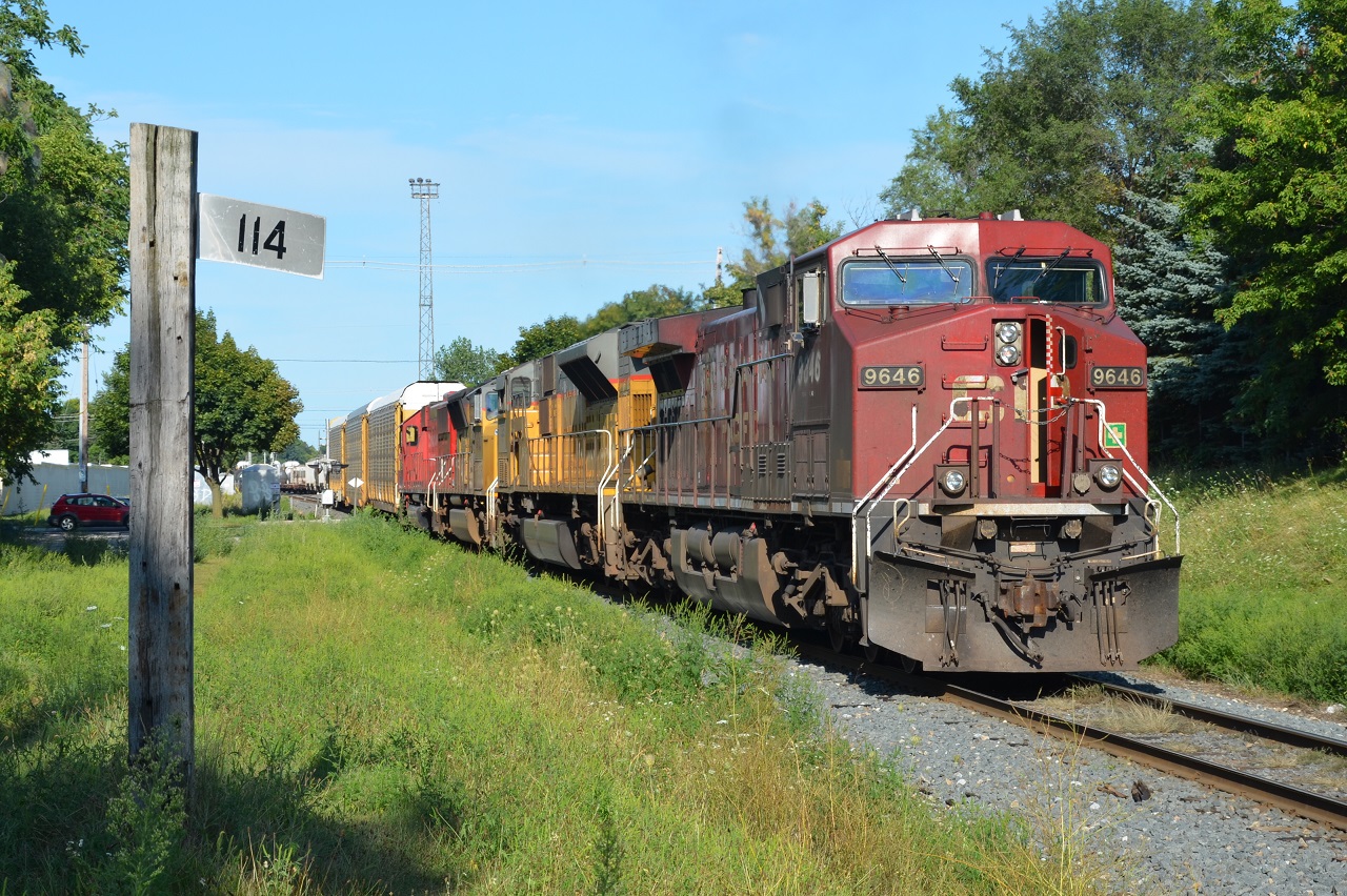 CP 241 makes one of it's many lifts and pulls out of the yard to mile 114 needing a fair bit of head room. This marker is .6 miles before the beginning of the CP Windsor Sub.