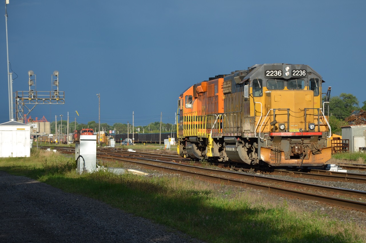 After getting rained on, the sun was finallly out and seemed brighter than ever. The sun seemed to make the clouds darker than they aactually were.