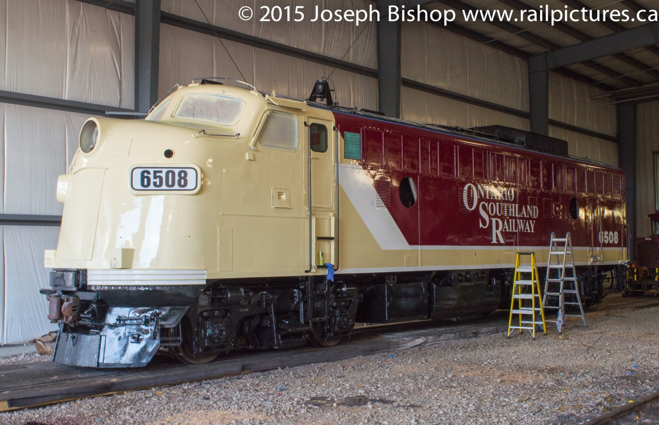 OSR 6508 sits in the shop at Salford awaiting some finishing touches to its new corporate image paint scheme.  Originally the final product of 6508 was intended to be kept a secret until reveal but yesterday a photo leaked onto Facebook and went viral.  This morning a photo of the unit was uploaded to the official OSR Facebook page so the cat is out of the bag which is why I have posted this shot.  Needless to say, the Ontario Southland has done an exceptional job making 6508 look great and I cannot wait to see it leading trains in the near future.