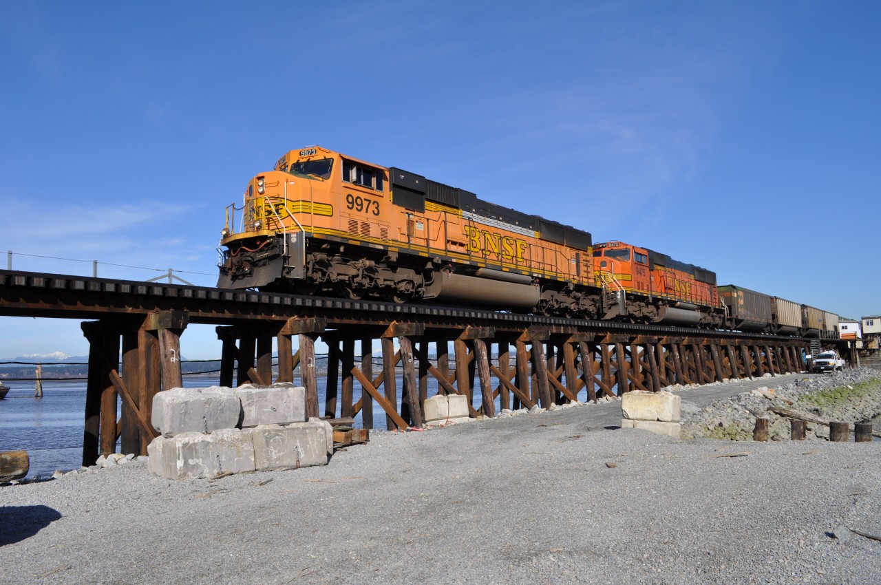Returning from Roberts Bank coal port. An empty coal train crosses the Mud Bay trestle.