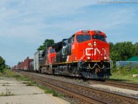 CN 3002, a GE ET44AC leads train 384 through Ingersoll Ontario on a sunny August morning.  3002 is one of the first tier 4 GEVO's to be delivered to CN and is just over a week old.