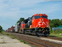 CN 3002, a GE ET44AC leads train 384 through Ingersoll Ontario on a sunny August morning.  3002 is one of the first tier 4 GEVO's to be delivered to CN and is just over a week old.