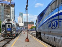 <b>Start of the afternoon rush hour.</b> AMT 1325 is leading AMT 19 towards Lucien L'Allier station in Montreal. This train will leave at 1545 for Vaudreuil. At left is AMT 185 for Saint-Jérôme and at right is AMT 87 for Candiac.