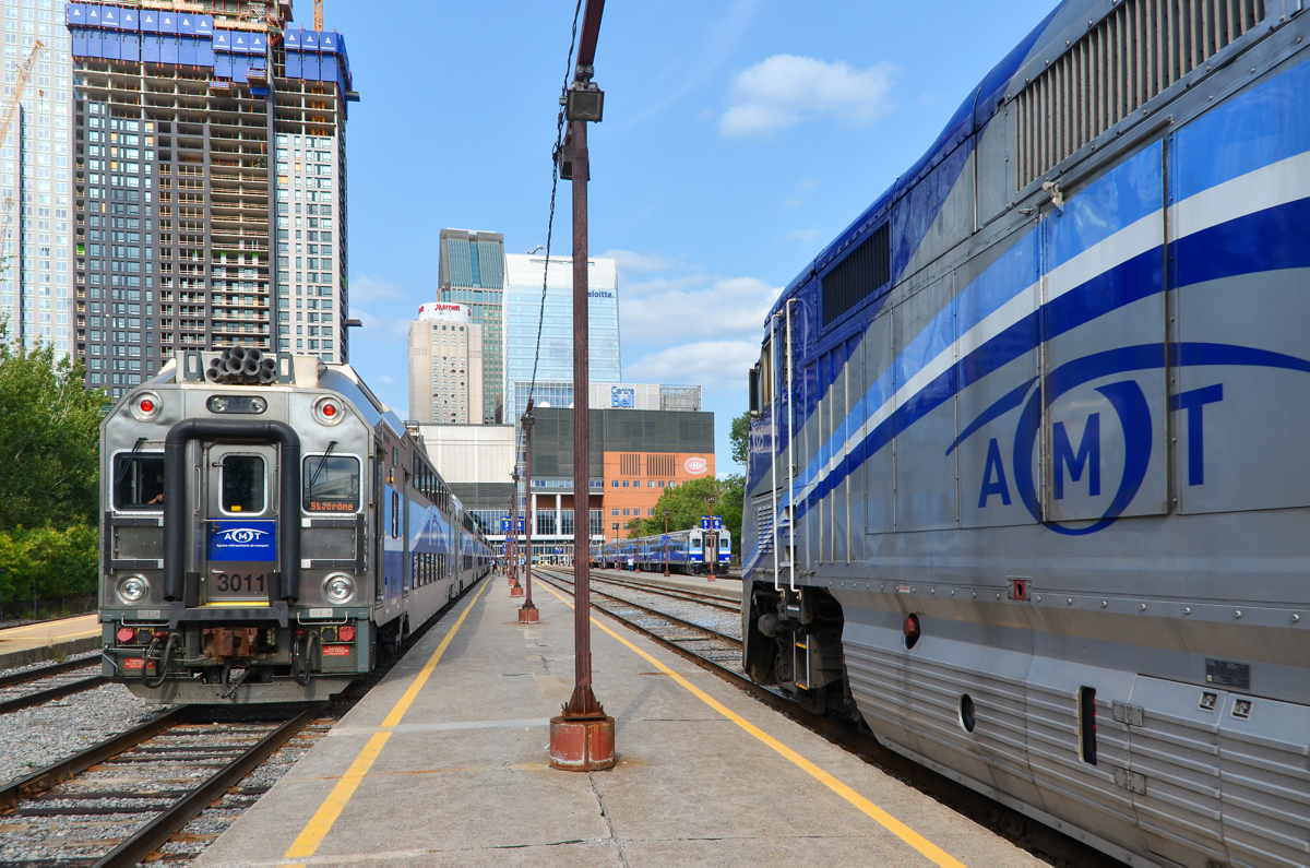 Start of the afternoon rush hour. AMT 1325 is leading AMT 19 towards Lucien L'Allier station in Montreal. This train will leave at 1545 for Vaudreuil. At left is AMT 185 for Saint-Jérôme and at right is AMT 87 for Candiac.