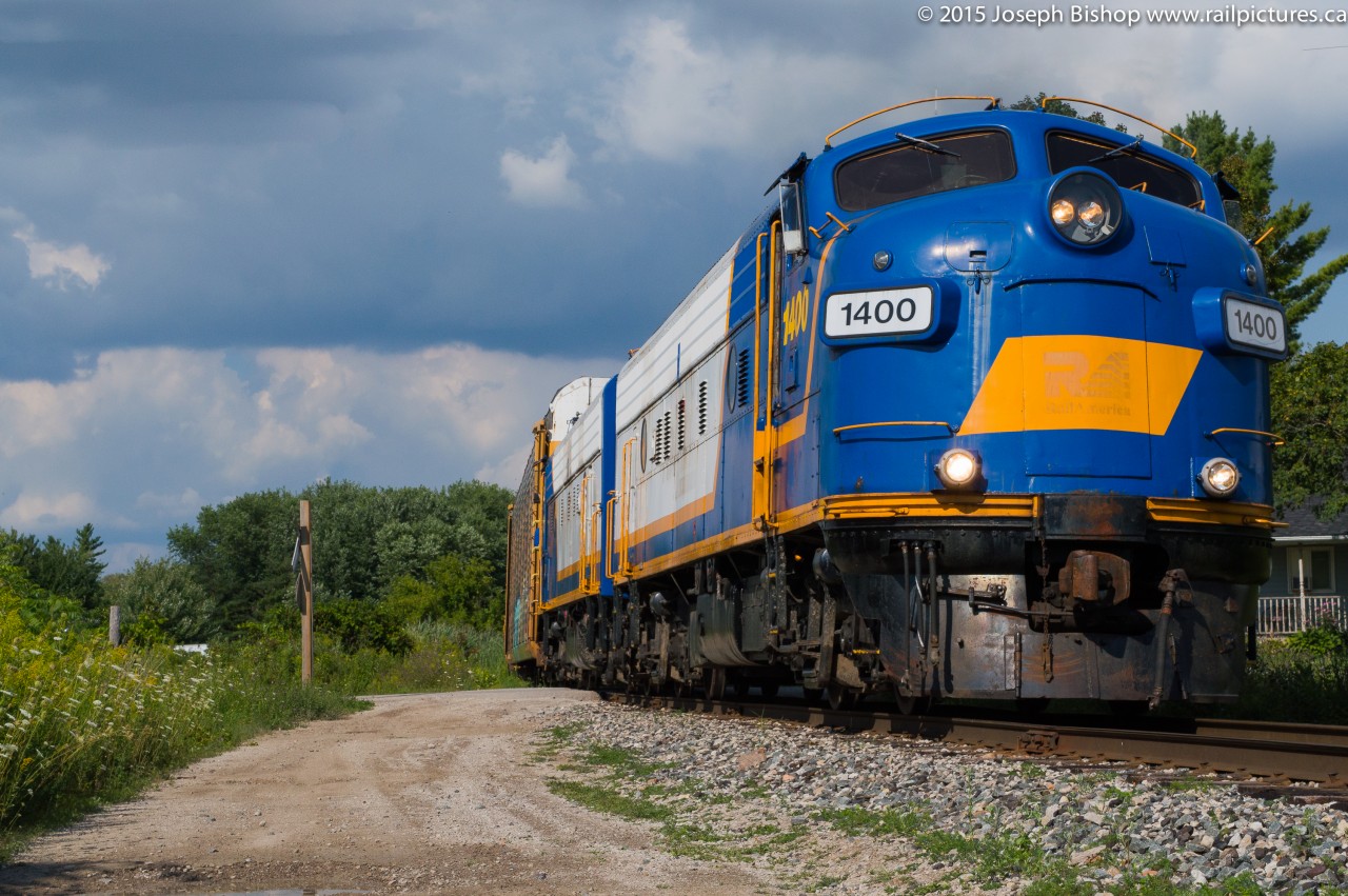 The OSR Woodstock Job leans into a curve on their way to the GM Cami plant outside of Ingersoll Ontario.  The power on this day was OSR 1400 and 1401, two of the three F Units on the OSR.  OSR 6508 is in the paint shop and should be emerging soon in corporate colours.