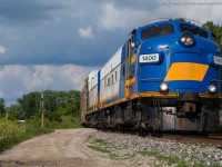 The OSR Woodstock Job leans into a curve on their way to the GM Cami plant outside of Ingersoll Ontario.  The power on this day was OSR 1400 and 1401, two of the three F Units on the OSR.  OSR 6508 is in the paint shop and should be emerging soon in corporate colours.