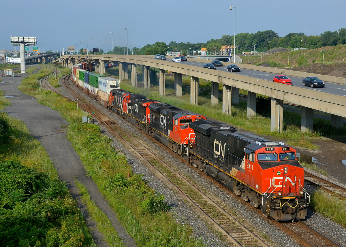 I'm going to miss this spot. The Angrignon overpass over CN's busy Montreal sub makes a nice location for eastbound's in the morning and westbound's in the afternoon, but this area will be changing drastically in the future with CN's tracks moving further north and much of the highway and overpass infrastructure changing. This morning I shot CN 120 approaching the overpass during some nice light (it would cloud over not too long after). The lashup had 4 unit types (ES44DC CN 2311, SD70M-2 CN 8917, Dash8-40CW CN 2141 & GP40-2L(W) CN 9673).