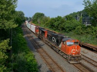 <b>The usual CN power.</b> SD75I CN 5778 & Dash9-44CW CN 2647 lead a short (172 axles) CN 324 through the Ville St-Pierre neighbourhood in Montreal.