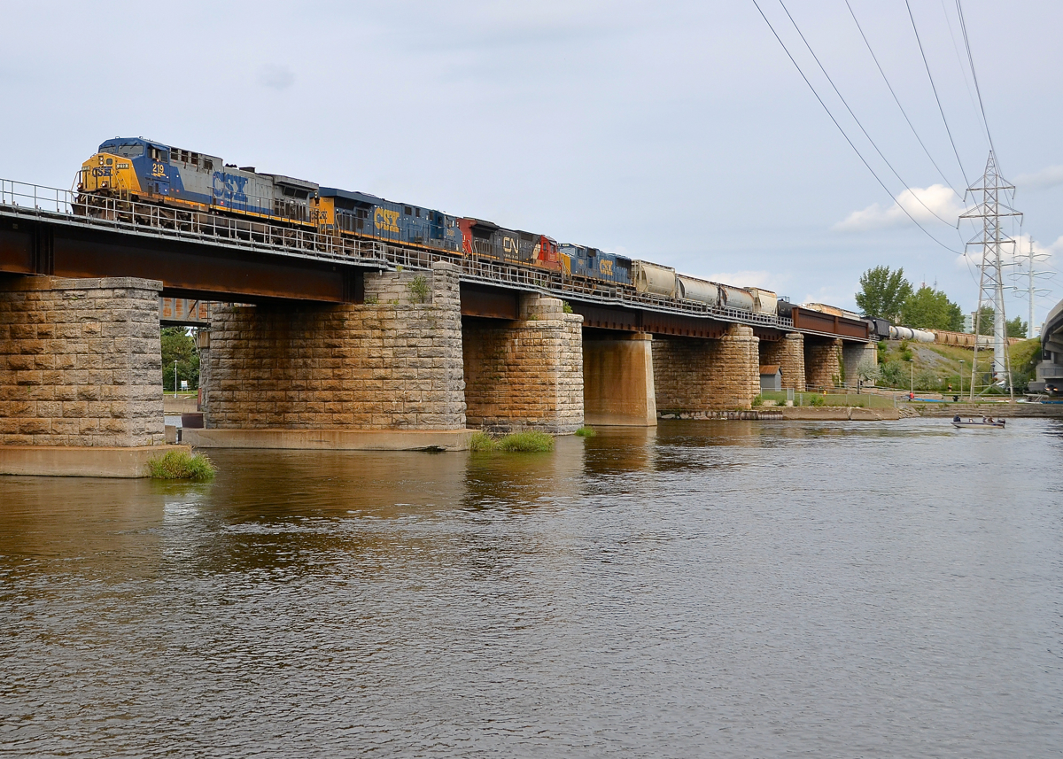 More power than usual. CN 327 has three CSXT units and one CN unit as it crosses over the Ottawa River (CSXT 219, CSXT 5381, CN 2025 & CSXT 4684).