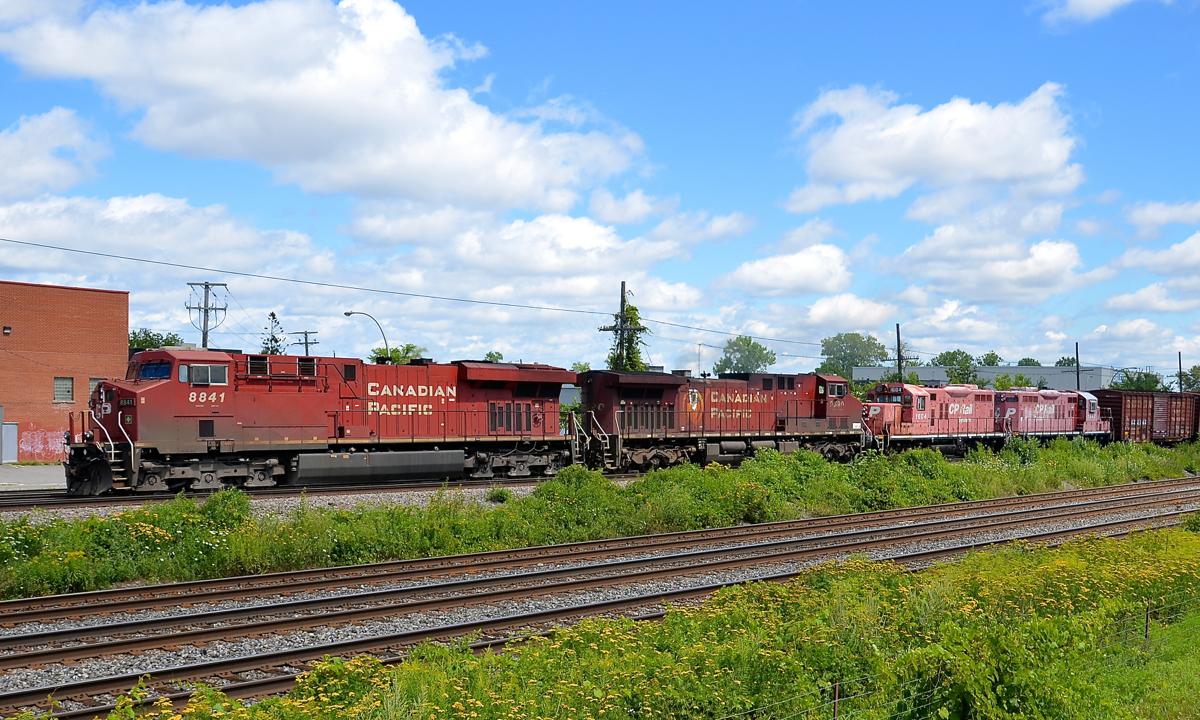 CP 119 has two horribly faded GP9's in tow as it leaves Dorval after finishing putting its train together in Lachine. Lashup is CP 8841, CP 9590, CP 1604 & CP 1547.