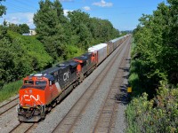 CN 401 has a pair of ES44AC's with a relatively new leader (CN 2948 & CN 2818) as it approaches Taschereau yard.